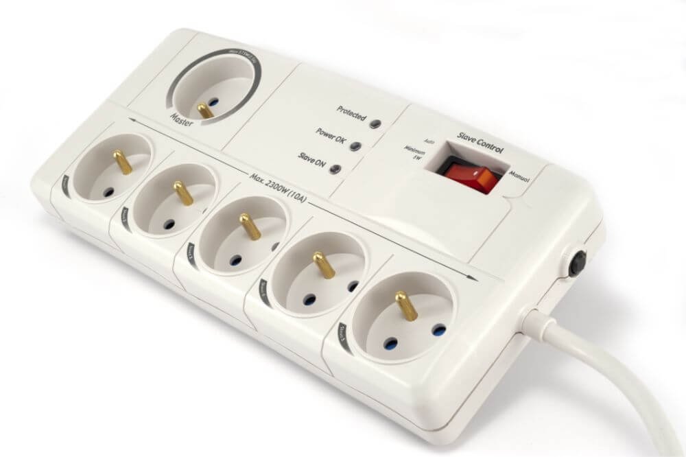 If you have invested in a small surge protector, one of the models that looks like a little power strip which you can plug appliances into, you might be wondering just how well it can protect your devices, electronics, and appliances. You probably got that surge protector so you can rest assured that power surges won’t fry that brand new TV.  In most cases, a surge protector will work just fine. However, a small power surge that originates from the power company, the power grid, or from within your own home is a bit different than a lightning strike. So, does a surge protector protect against lightning?  Surge Protectors and Lightning Strikes A very important thing to know is how much or how strong of a power surge your average surge protector can handle. Once again, here we are talking about the power strip-type surge protectors. These tend to be rated at about 15 amps, with some going a few amps higher than that. This should be enough for most basic power surges, but what about a lightning strike? A direct lightning strike, on average, will come in at anywhere from 5,000 to 20,000 amps. However, extremely heavy lightning strikes have been known to register as high as a whopping 200,000 amps, so, you can do the math here. In a worst case scenario, a surge protector rated for 15 amps, when hit with 200,000 amps of electricity, will still leave a massive 199,985 amps for your electronics to deal with. It doesn’t take much to figure out that the result here is a fried and probably melted television. A surge protector might be able to deal with smaller lightning strikes that hit many miles away from your home and hit the power grid. The reason they may be able to handle this is because by the time that lightning strike gets to your home, a lot of the amperage has already dissipated, but even then, an average surge protector may still not do the trick. There are much better in-home surge protectors that feature disconnects which totally shut the power off. These can help add a bit more protection, but then again, a lightning bolt that traveled several miles probably won’t be deterred by a couple inches of space which that disconnect provides. Therefore, simply put, no, a surge protector won’t do a single thing to stop that lightning strike from deep frying your television and anything else you have plugged in.  Protecting Your Electronics From Lightning  Although your basic surge protector won’t do anything to stop the tremendous amperage which a lightning bolt produces, there are some steps you can take to help prevent your electronics from winding up in the trash can after a lightning storm.  Service Entry Surge Protectors If you are still looking to get a surge protector to protect against massive energy surges, such as from lightning strikes, your best bet is to go for a service entry surge protector. These are installed before the circuit breaker in your home, thus protecting your whole home. Now, these are not overly expensive to buy, but can be very costly to install. These kinds of surge protectors can handle many more amps than an in-home or power strip-type surge protector, potentially up to hundreds or even thousands of amps depending on the specific unit in question. That said, this still won’t be enough to stop a direct lightning strike. A Full Lightning Protection System A full-fledged lightning protection system, one that consists of lightning rods, cables, and grounding, are your best bet to protect your electronics against full lightning strikes. These can divert virtually all of the amps which would otherwise hit your home head on.  Now, the best lightning protection systems can divert nearly 100% of the amps from your home, which should be enough to save your valuable electronics. However, these must be top-quality lightning protection systems, or else even these cannot guarantee total protection.  Unplug it All Quite honestly, the best way to stop a lightning strike from frying your television is simply by unplugging it. Whatever it may be, in the vast majority of direct lighting strikes, there is nothing that can fully protect your home and its electronics 100%. The only way to really stop the current from ruining your valuables is to unplug them from any and all outlets. Conclusion The bottom line is that no, surge protectors will not protect against a lightning strike. Lightning is too powerful for even the best surge protectors to handle. Unfortunately, this is the way it is. Mother nature can be cruel, so while you can be prepared, being 100% protected in this sense is virtually impossible.